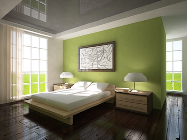 room with a beside table and lamp on each side